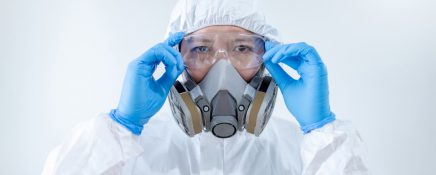 Scientist wearing biohazard chemical protective suit